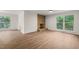 Living room featuring a stone fireplace and light hardwood floors at 1411 Rosewood St, Durham, NC 27701
