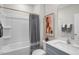 Clean bathroom with modern vanity, a shower-tub combination, and neutral-toned decor at 149 Ethel Ln, Angier, NC 27501