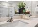 Bathroom featuring double sinks, modern fixtures and a sliding glass shower door at 149 Ethel Ln, Angier, NC 27501