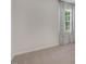 Carpeted bedroom featuring a window with bright natural light and neutral-colored walls at 149 Ethel Ln, Angier, NC 27501