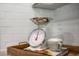 Close-up of a kitchen featuring white subway tiles and stylish kitchen scale and measuring cups at 149 Ethel Ln, Angier, NC 27501