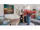 Interior living space featuring kitchen, stairs, modern decor, and stainless steel appliances at 149 Ethel Ln, Angier, NC 27501