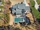 Aerial view of the backyard with the pool and landscaped patio at 1520 Grand Willow Way, Raleigh, NC 27614