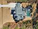 Birds-eye view of a luxurious two-story home featuring a pool, patio, and manicured landscaping at 1520 Grand Willow Way, Raleigh, NC 27614