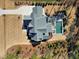 Overhead view of a backyard oasis with sparkling pool, outdoor seating, and manicured landscaping at 1520 Grand Willow Way, Raleigh, NC 27614