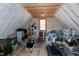 Attic with exposed beams and insulation, showing storage and potential for conversion at 1520 Grand Willow Way, Raleigh, NC 27614