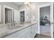 Bathroom featuring double vanity with white marble countertop and modern chrome fixtures at 1520 Grand Willow Way, Raleigh, NC 27614