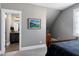 Bedroom with a view into the modern bathroom and tiled shower area at 1520 Grand Willow Way, Raleigh, NC 27614