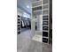 Spacious walk-in closet with custom shelving and a mirrored partition at 1520 Grand Willow Way, Raleigh, NC 27614