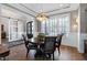 Bright dining area with natural light, wood floors, and modern chandelier at 1520 Grand Willow Way, Raleigh, NC 27614