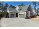 Charming home with a three-car garage and well-maintained landscaping set on a spacious lot at 1520 Grand Willow Way, Raleigh, NC 27614