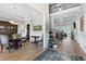 Elegant entryway featuring hardwood floors, a staircase, and open access to the dining and living areas at 1520 Grand Willow Way, Raleigh, NC 27614