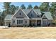 Charming two-story home featuring a beautifully landscaped front yard and traditional architectural details at 1520 Grand Willow Way, Raleigh, NC 27614