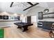 Entertain in style in this game room complete with a pool table, kitchenette, and hardwood floors at 1520 Grand Willow Way, Raleigh, NC 27614