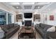 Comfortable living room featuring a fireplace, built-in shelving, and access to outdoor space at 1520 Grand Willow Way, Raleigh, NC 27614