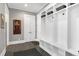 Mudroom features custom built-in storage with bench seating and stylish decor at 1520 Grand Willow Way, Raleigh, NC 27614