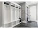 Organized mudroom with built-in storage, hooks, and baskets for convenient entryway solutions at 1520 Grand Willow Way, Raleigh, NC 27614