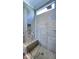 Modern shower with sleek gray tiles, a built-in bench, and a glass enclosure, offering a spa-like retreat at 1520 Grand Willow Way, Raleigh, NC 27614