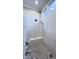 Modern shower with bench, marble tile and dual shower heads at 1520 Grand Willow Way, Raleigh, NC 27614