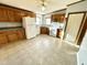 Kitchen with wood cabinets, white appliances, and a tiled floor at 15616 Nc 96 Hwy, Zebulon, NC 27597