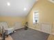 Bonus room featuring yellow walls and carpet flooring at 1617 Heritage Club Ave, Wake Forest, NC 27587