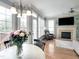 Bright living room with fireplace, hardwood floors, and lots of natural light at 1617 Heritage Club Ave, Wake Forest, NC 27587