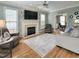 Cozy living room with fireplace, ceiling fan, and decorative rug at 1617 Heritage Club Ave, Wake Forest, NC 27587