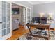 Bright home office with desk and hardwood floors at 1617 Heritage Club Ave, Wake Forest, NC 27587