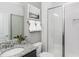 Modern bathroom with a granite-topped vanity, white subway tile shower, and decorative accents at 1808 Angelonia Way, Fuquay Varina, NC 27526