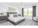 The serene bedroom features soft lighting, a comfortable bed, and elegant decor, creating a peaceful and relaxing retreat at 1808 Angelonia Way, Fuquay Varina, NC 27526