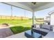 Covered patio featuring an outdoor seating area, fire pit, and view of the lawn at 1808 Angelonia Way, Fuquay Varina, NC 27526