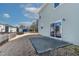 Backyard with a small concrete patio, a sliding door entrance, and a wooden fence surrounding the perimeter at 2000 Muddy Creek Ct, Raleigh, NC 27610