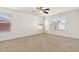 Bright bedroom with a ceiling fan and large windows, creating a cozy and inviting space at 2000 Muddy Creek Ct, Raleigh, NC 27610