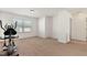 Spacious bedroom with a large window and neutral carpet, perfect for a home gym at 2000 Muddy Creek Ct, Raleigh, NC 27610
