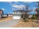 Two-story home features a two-car garage, neutral siding, and a well-manicured front yard at 2000 Muddy Creek Ct, Raleigh, NC 27610