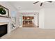 Open concept living room flows into kitchen, with fireplace and plenty of natural light at 2000 Muddy Creek Ct, Raleigh, NC 27610