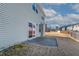 Back of the home featuring vinyl siding and a sliding glass door that opens onto a concrete patio area at 2000 Muddy Ct, Raleigh, NC 27610