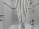 Bathroom shower featuring elegant tiling, a shower head, and stylish fixtures at 2001 Carrington Dr, Raleigh, NC 27615