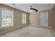 Neutral bedroom with carpet, ceiling fan, and natural light at 2001 Carrington Dr, Raleigh, NC 27615
