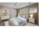 Bright bedroom with a comfortable bed, side tables, lamps and natural light at 2001 Carrington Dr, Raleigh, NC 27615