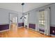 Bright dining room offers hardwood floors, large windows, natural light and neutral color palette at 2001 Carrington Dr, Raleigh, NC 27615