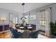 Elegant dining room with contemporary light fixture, stylish seating, and abundant natural light at 2001 Carrington Dr, Raleigh, NC 27615