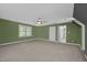 Spacious living room with a ceiling fan and natural light at 2001 Carrington Dr, Raleigh, NC 27615