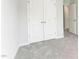 Bright bedroom with closet, plush carpeting, and freshly painted walls at 2004 Regal Dr # 86, Durham, NC 27703