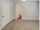 Clean bedroom with neutral walls, carpet, and a view into a well-lit bathroom for added convenience at 2005 Silent Bend Dr, Durham, NC 27704