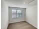 Bright bedroom with a large window and neutral-colored carpet, creating a cozy and inviting space at 2005 Silent Bend Dr, Durham, NC 27704