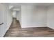 Spacious hallway with hardwood floors and bright lighting, showcasing the home's entrance at 2005 Silent Bend Dr, Durham, NC 27704