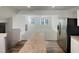 This view from the kitchen island shows an open floor plan into the living room at 2005 Silent Bend Dr, Durham, NC 27704