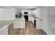 Modern kitchen with stainless steel appliances, granite countertops and white cabinets at 2005 Silent Bend Dr, Durham, NC 27704