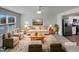 Bright, staged living room with neutral color palette, contemporary furniture, and stainless steel appliances at 2005 Silent Bend Dr, Durham, NC 27704